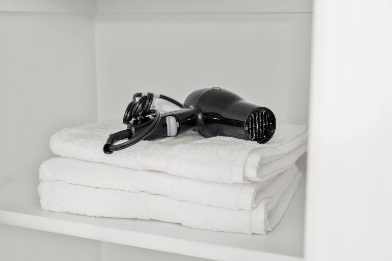 Hair dryer and fresh towels provided for your stay.
