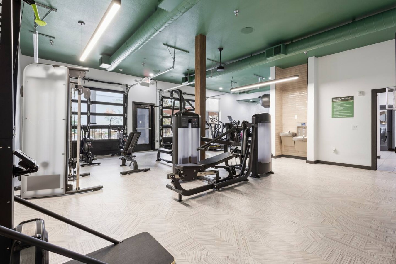 Shared fitness center with cardio and strength equipment.