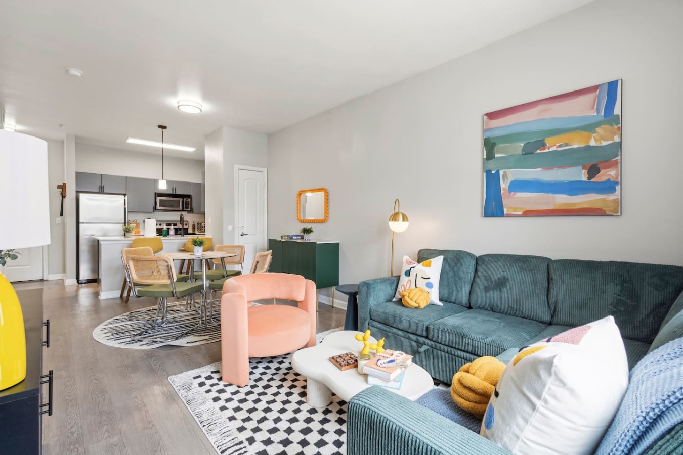 Open living and dining space with full kitchen nearby.