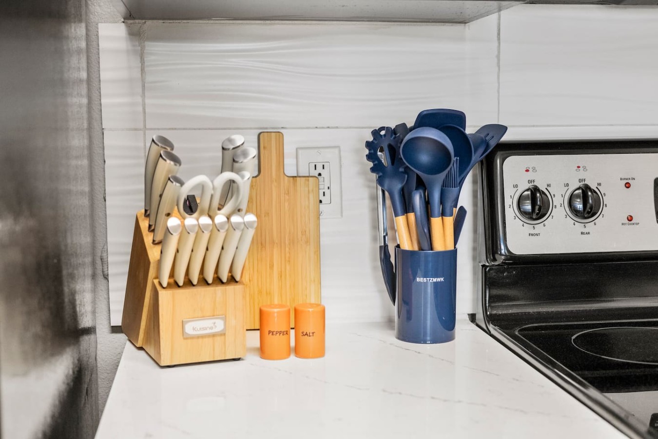 Well-stocked kitchen with knives, utensils, and essentials.