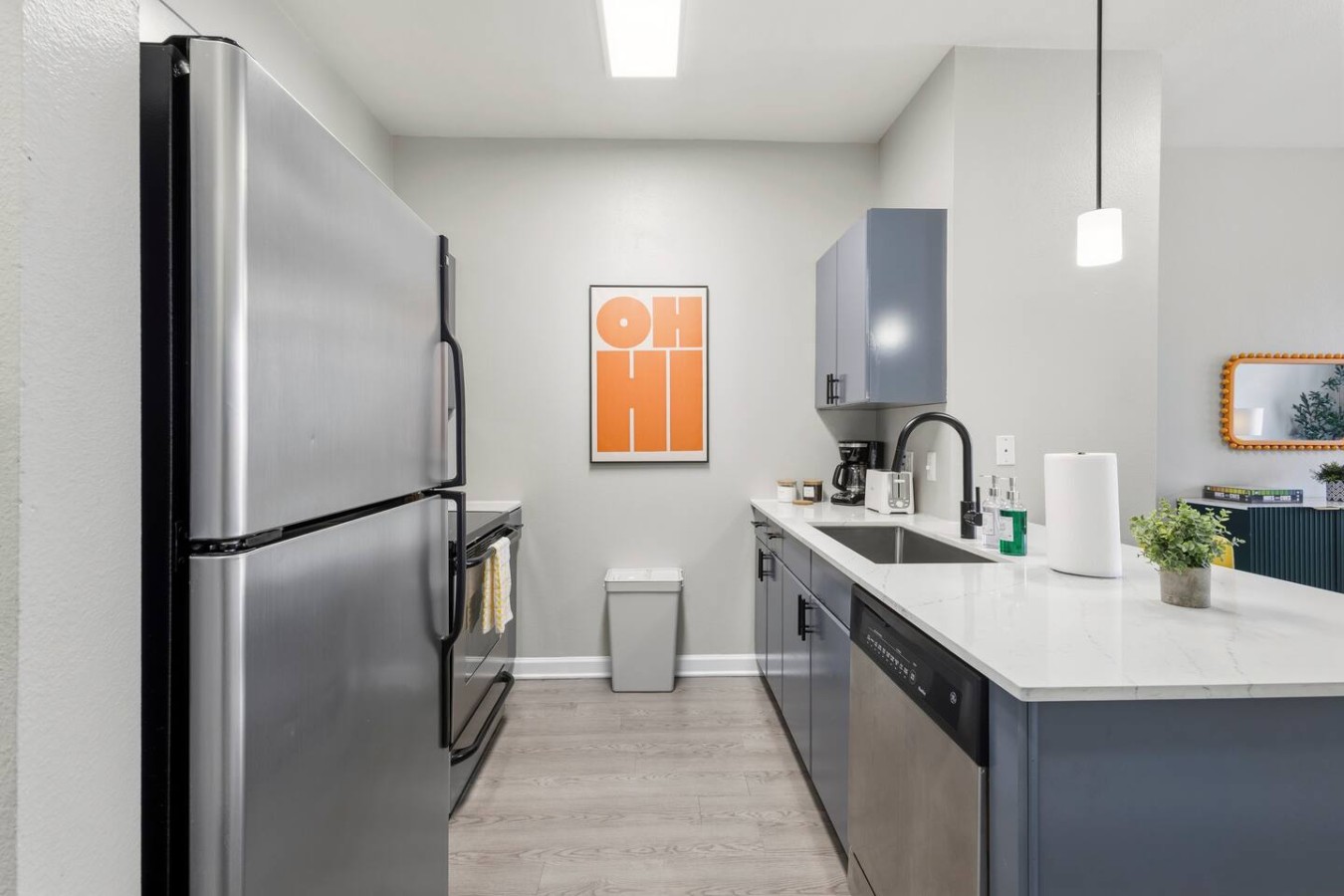 Kitchen with stainless steel fridge, stove, and modern appliances.