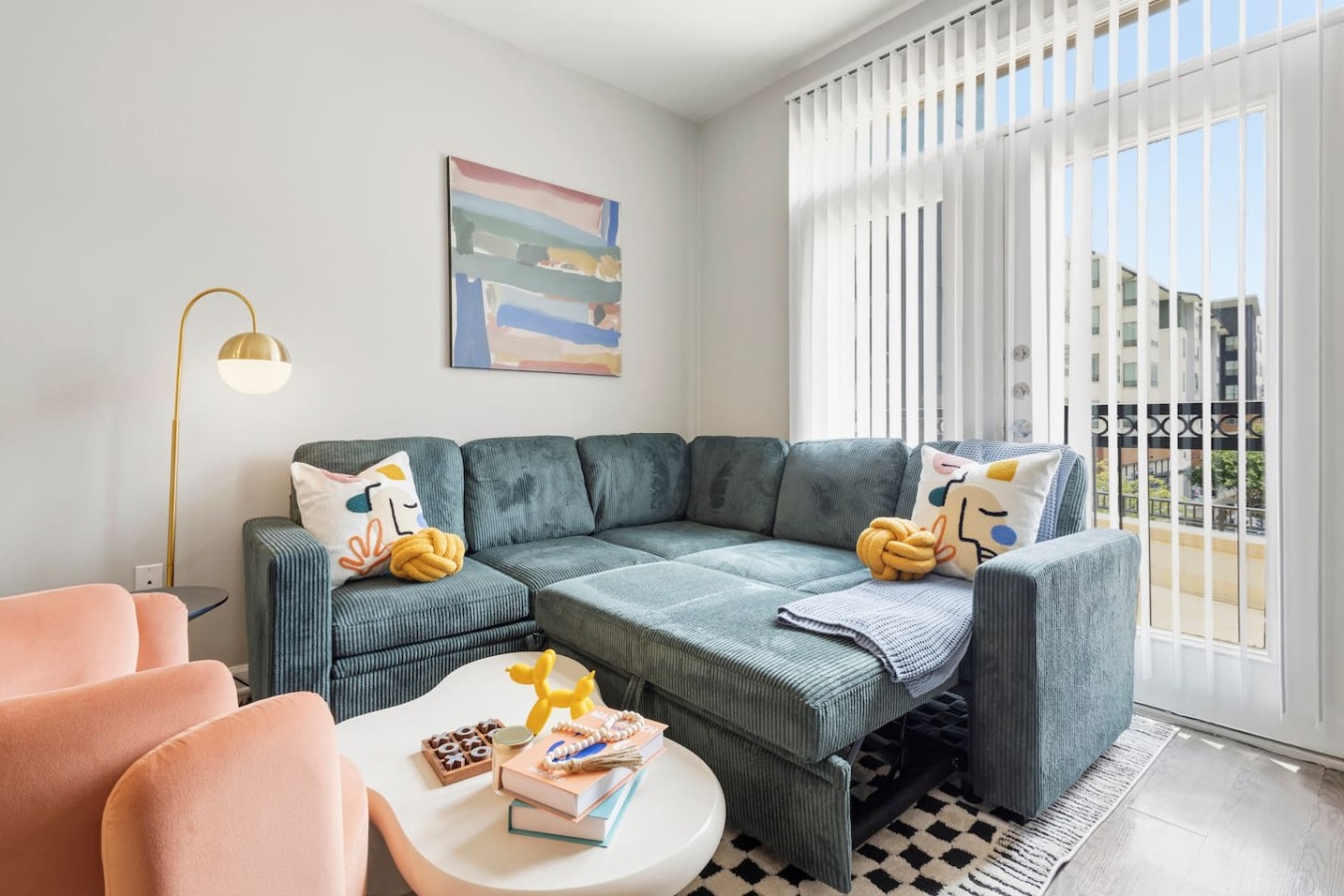 Comfortable lounge seating with bright balcony views.