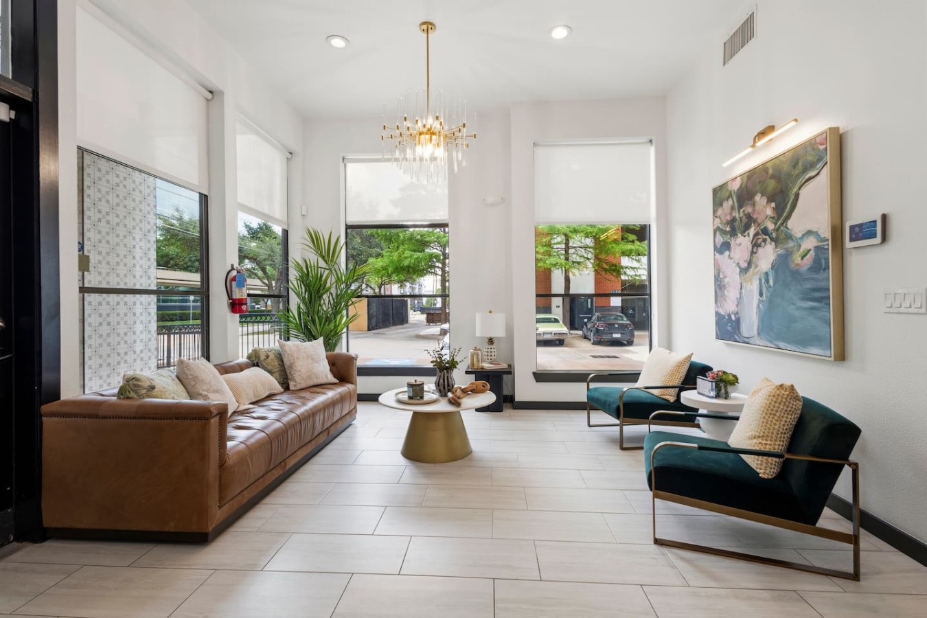Stylish lobby lounge with bright seating and modern decor.