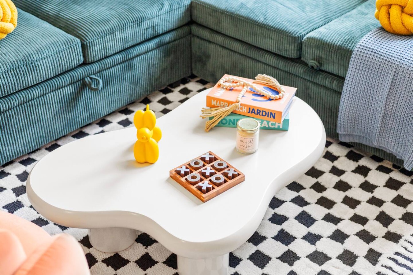 Close-up of coffee table with games and decor for relaxing moments.