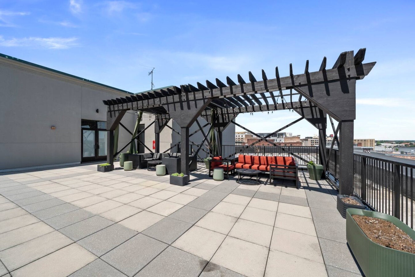 Enjoy city views and evenings under the stars in the expansive rooftop seating area and social pergola