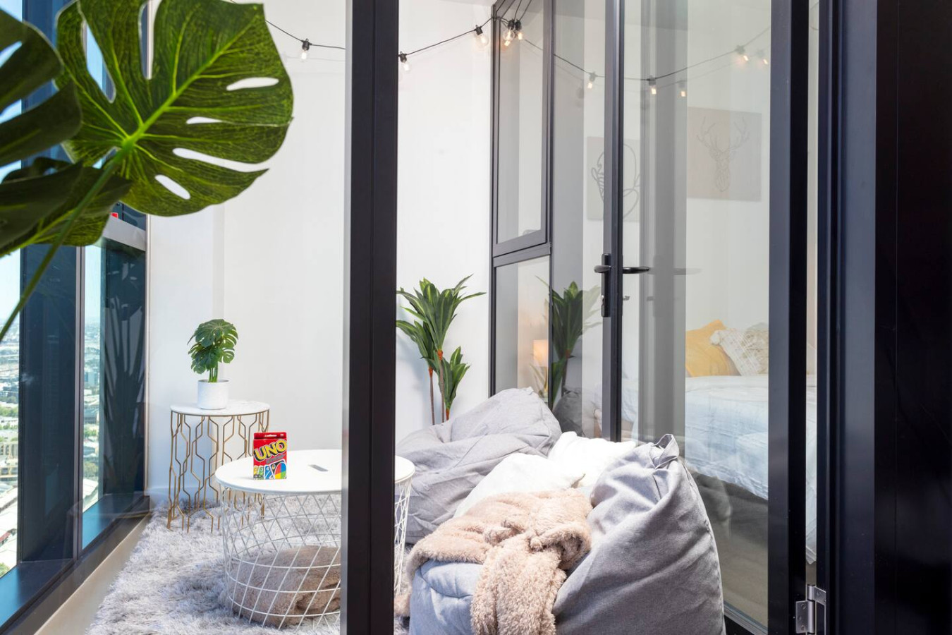 Unique Comfortable Balcony With Controllable Fairy Lights, Bean Bags, Card Games, Blankets, and Pillows