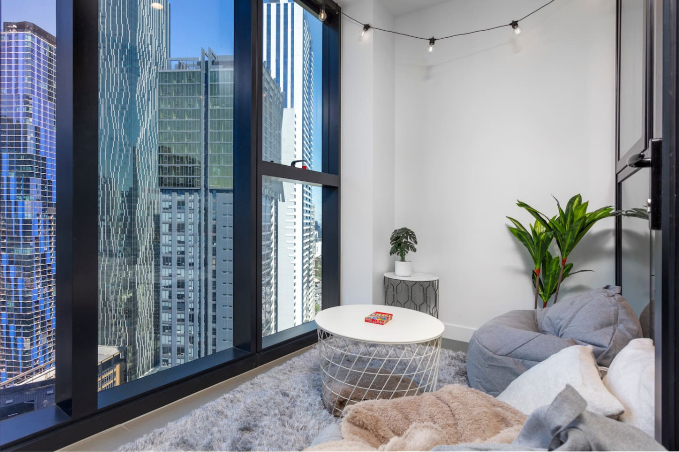 Unique Comfortable Balcony With Controllable Fairy Lights, Bean Bags, Card Games, Blankets, and Pillows