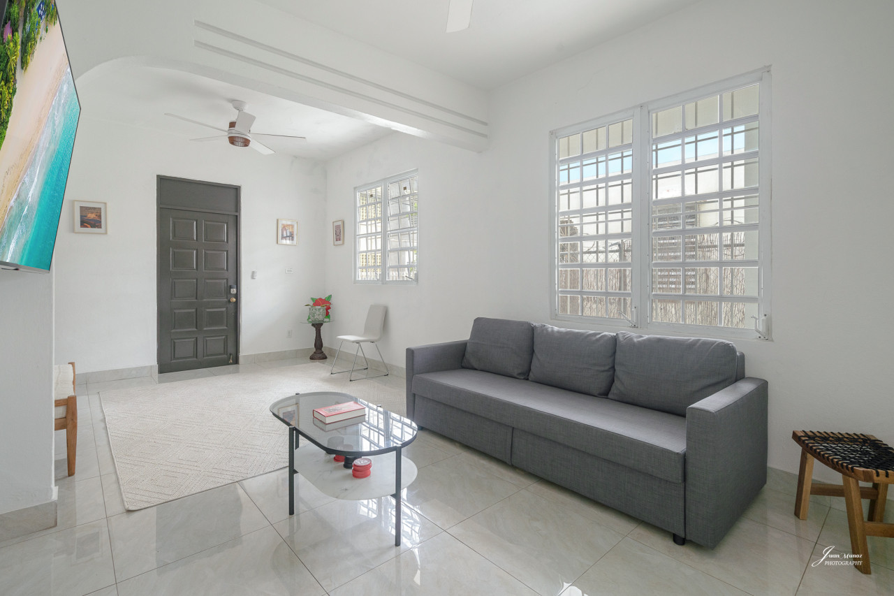 Living room with a couch and a table — Villa Blanca | San Juan | La Plácita, Miramar