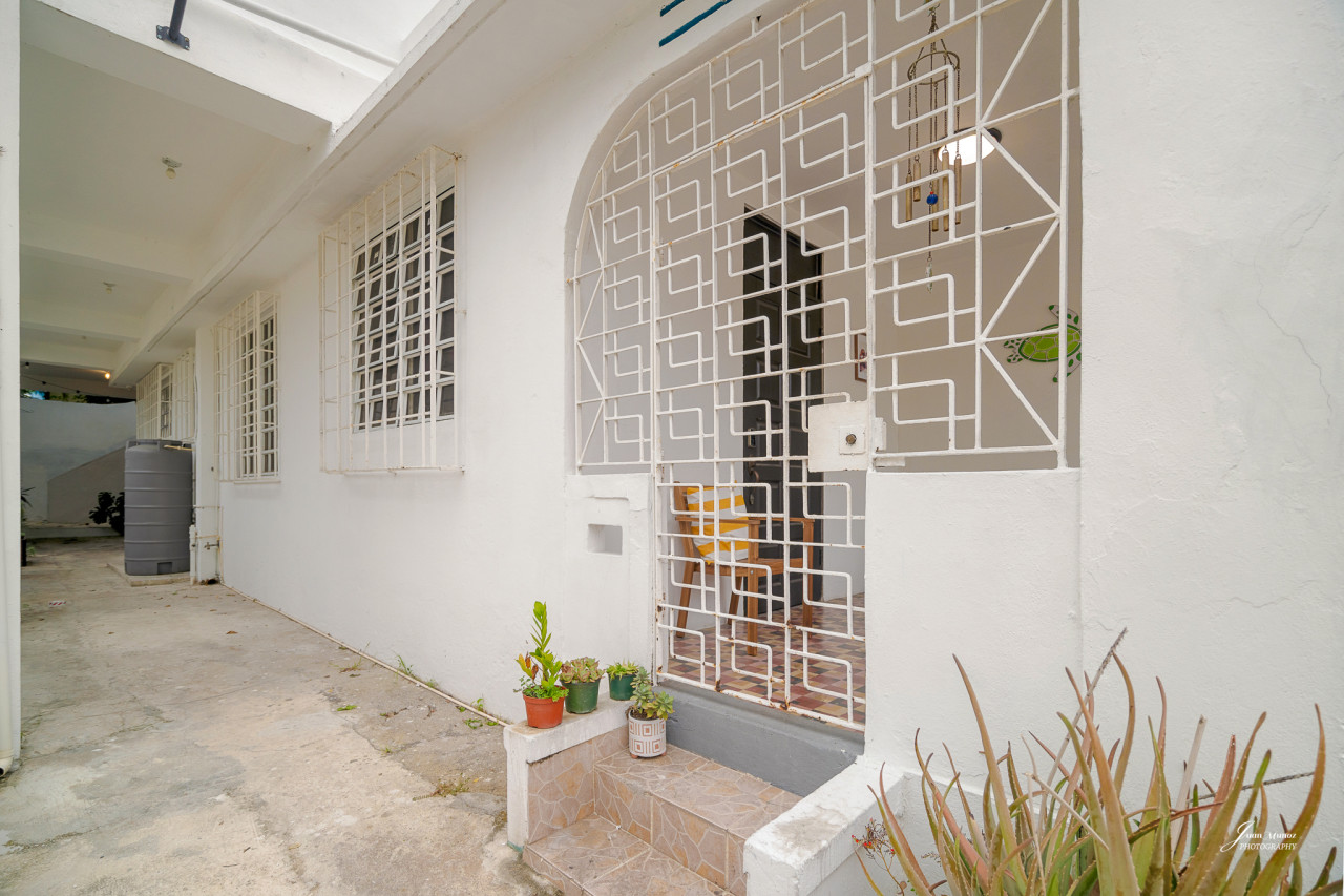 White house with a balcony and a view of the ocean — Villa Blanca | San Juan | La Plácita, Miramar