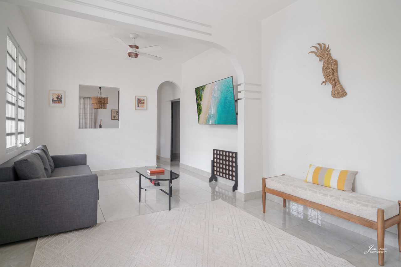 Living room with a flat screen TV on the wall — Villa Blanca | San Juan | La Plácita, Miramar