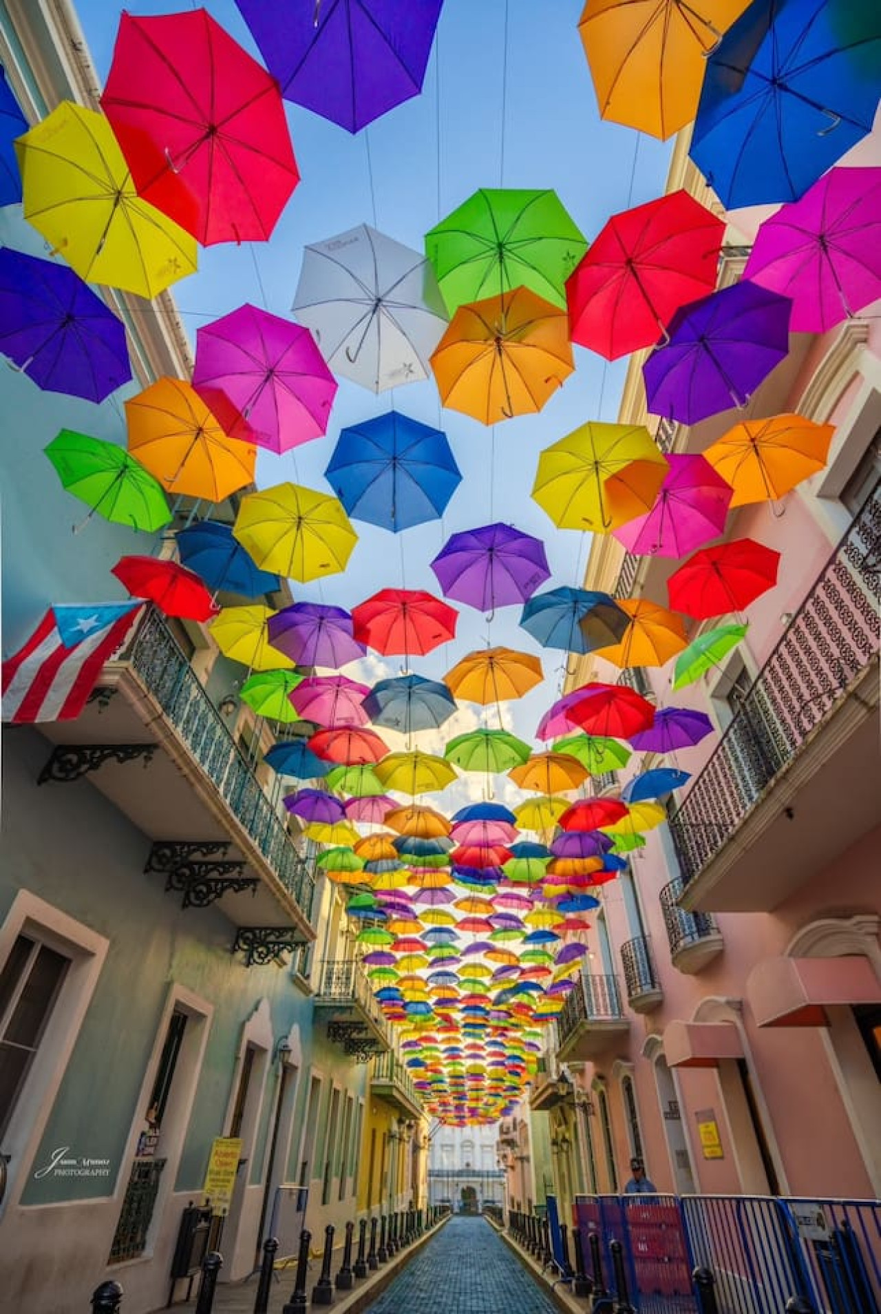 Colorful umbrellas hanging from a building in Puerto Rico — Ocean Breeze | Old San Juan | Spanish Style, Old San Juan