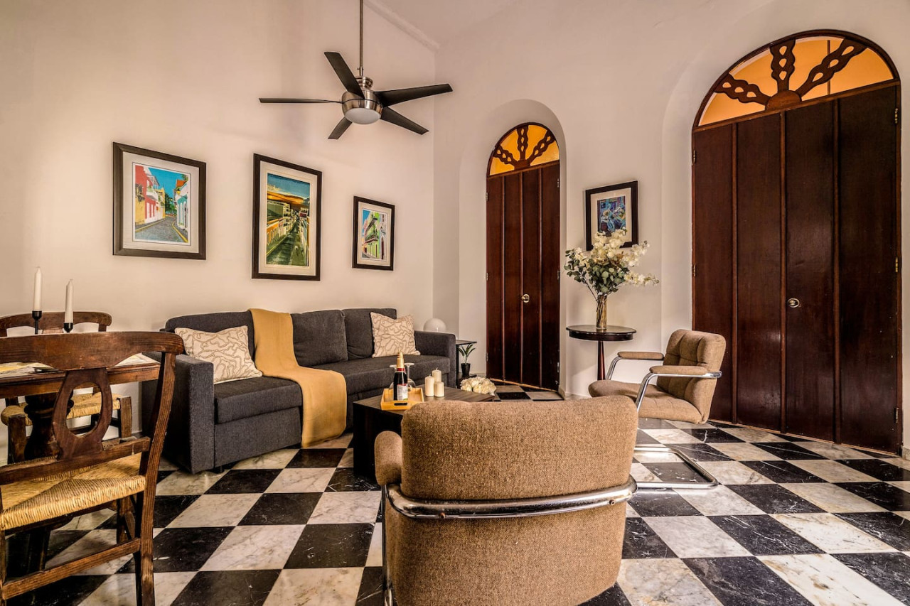 Living room with a couch and a chair — Ocean Breeze | Old San Juan | Spanish Style, Old San Juan