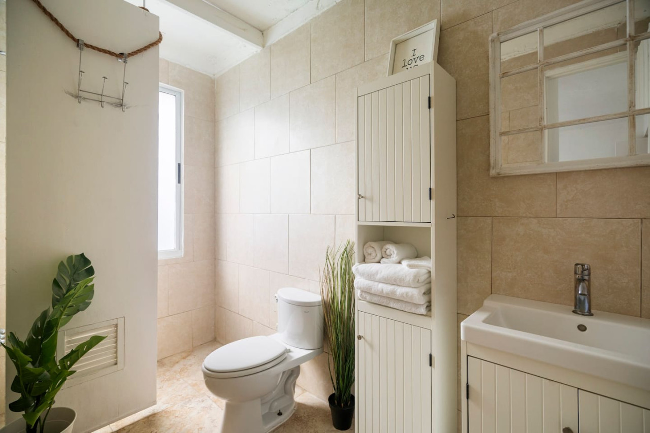 White toilet in a bathroom — Sunset Haven | Ocean Breeze | Old San Juan, Old San Juan