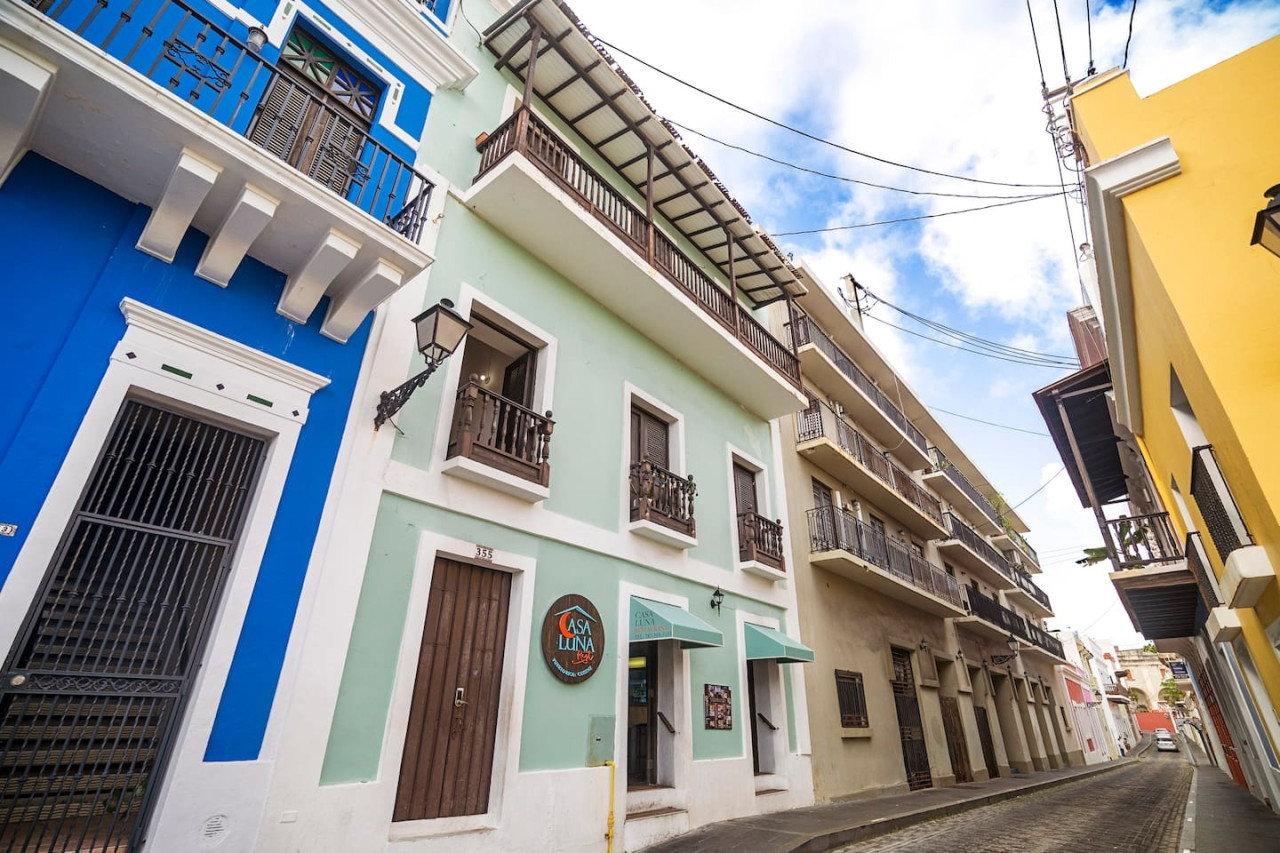 Blue and white building with a balcony — Sunset Haven | Ocean Breeze | Old San Juan, Old San Juan