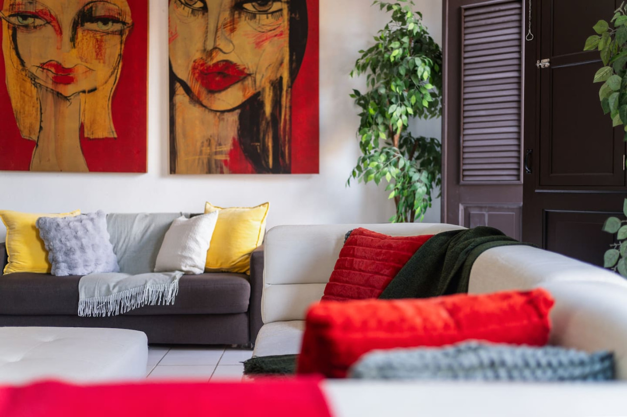 Living room with a couch and a potted plant — Spanish Penthouse Historic Mansion Private Patio, Old San Juan