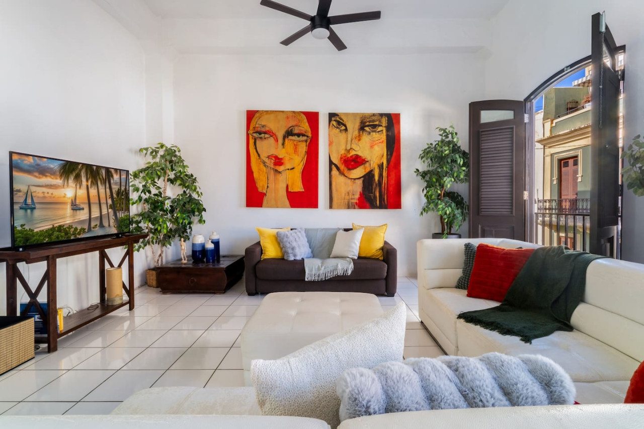 Two paintings of women on the wall — Spanish Penthouse Historic Mansion Private Patio, Old San Juan