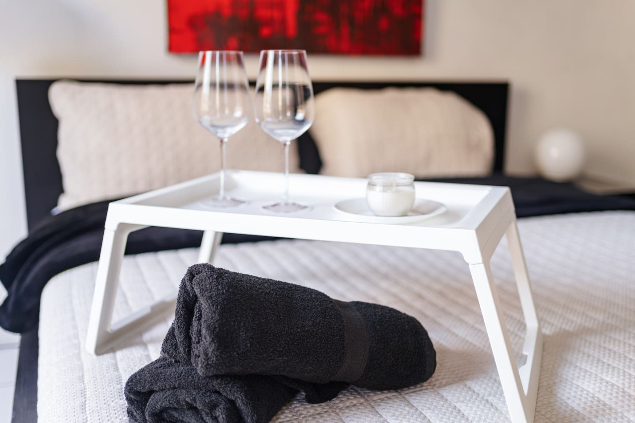 Bedroom with two wine glasses on a table — Spanish Penthouse Historic Mansion Private Patio, Old San Juan