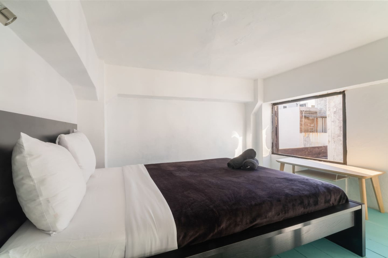 Bedroom with a bed and a window view — Spanish Penthouse Historic Mansion Private Patio, Old San Juan