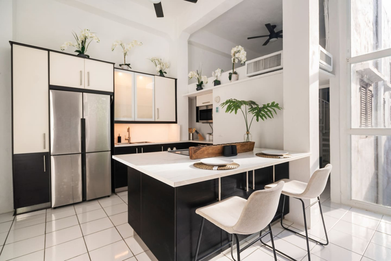 Kitchen with a white counter top and black cabinets — Spanish Penthouse Historic Mansion Private Patio, Old San Juan