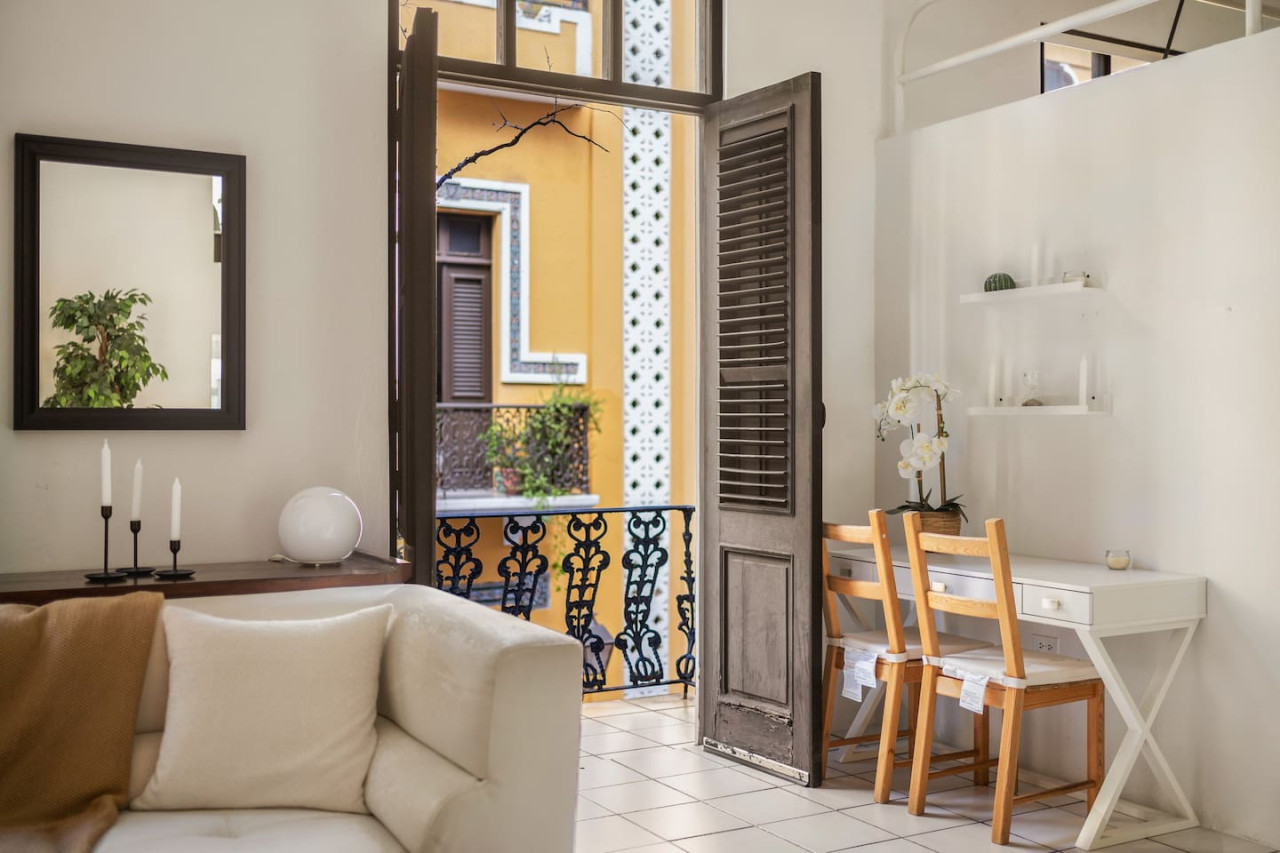 View of the balcony from the living room — Spanish Duplex | Private Patio | Walk to Ocean, Old San Juan