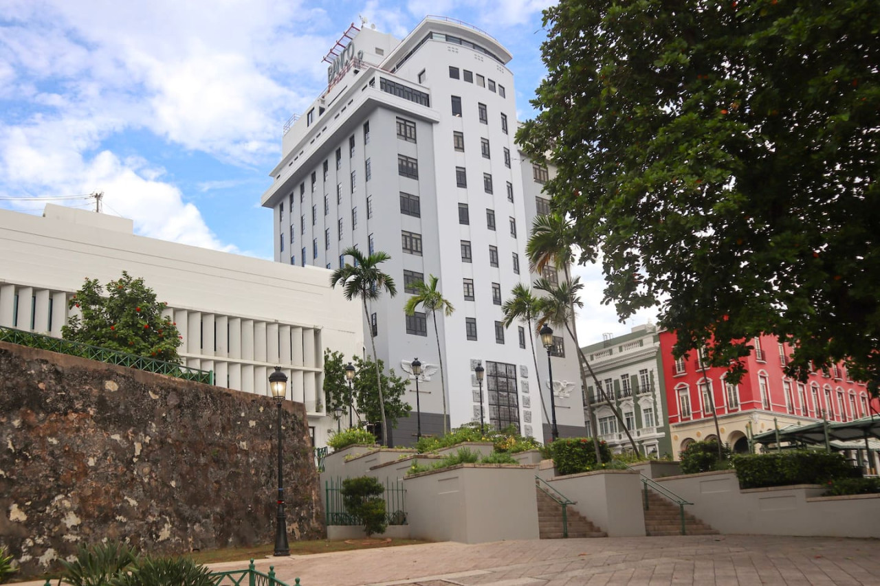 Tall white building with a balcony overlooking the ocean — Puerto Escape | Old San Juan, Old San Juan