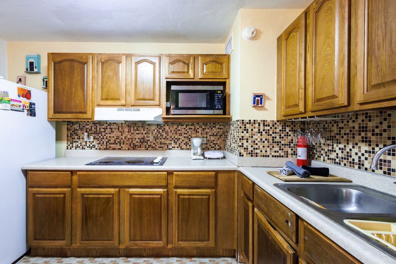 Kitchen with a microwave and a sink — Ocean Sol Historic Old San Juan