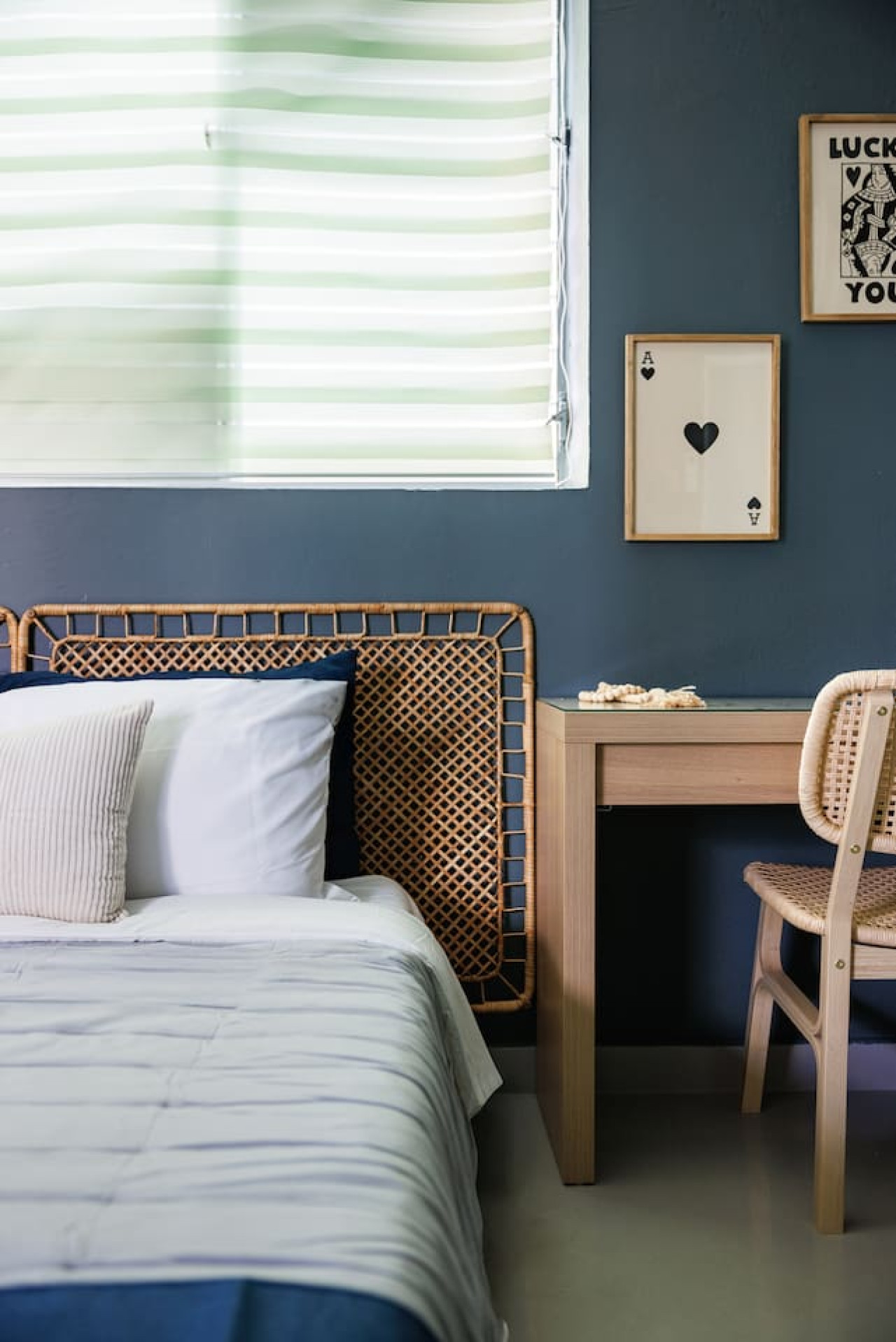 Bedroom with a white bed and a blue pillow — Spain Lagoon | San Juan | Private Patio, Santurce