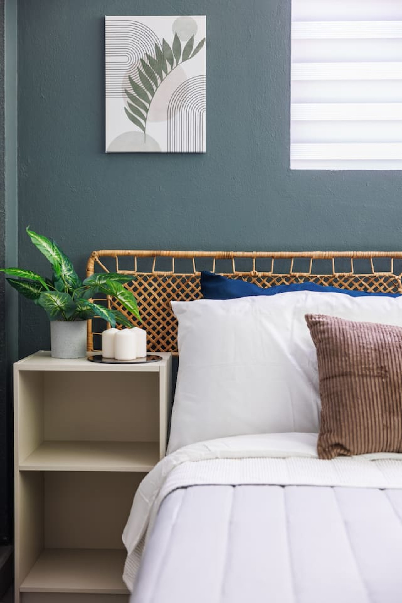Bedroom with a bed and a plant — Spain Lagoon | San Juan | Private Patio, Santurce