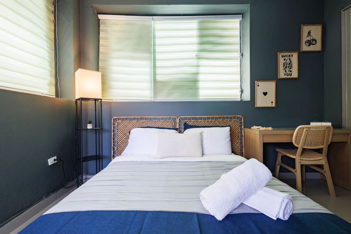 Bedroom with a large bed and a window with curtains — Spain Lagoon | San Juan | Private Patio, Santurce