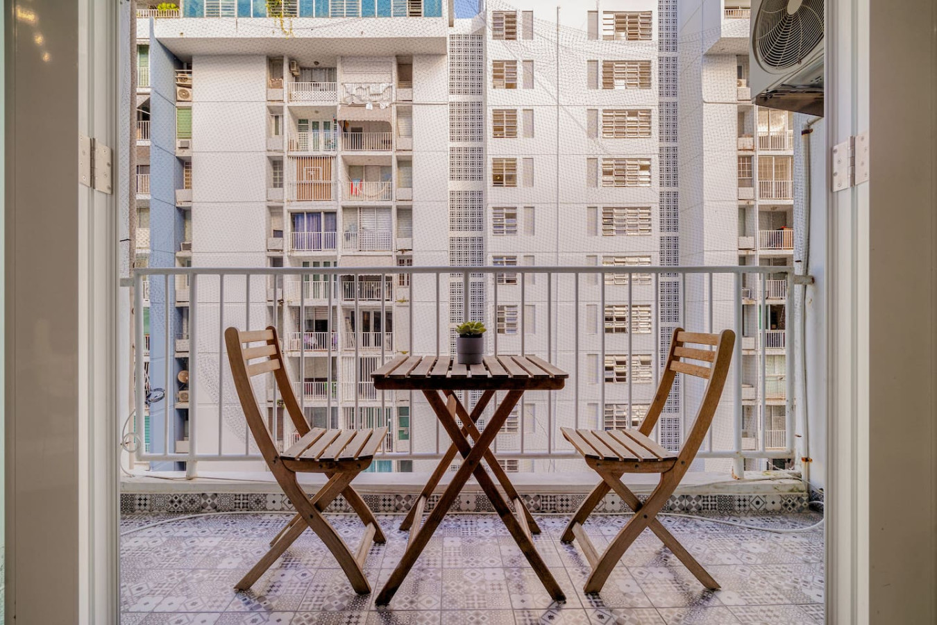 Balcony with a table and chairs on it — OceanSide - Pool Balcony, Isla Verde