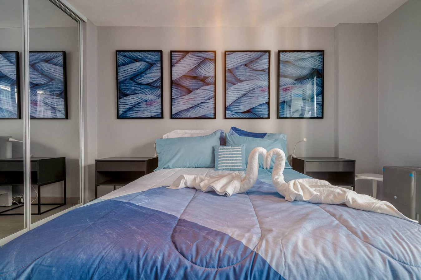 Bedroom with a blue bedspread and two pillows — OceanSide - Pool Balcony, Isla Verde