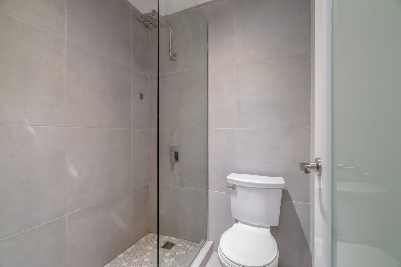 Bathroom with a glass shower and a toilet — OceanSide - Pool Balcony, Isla Verde