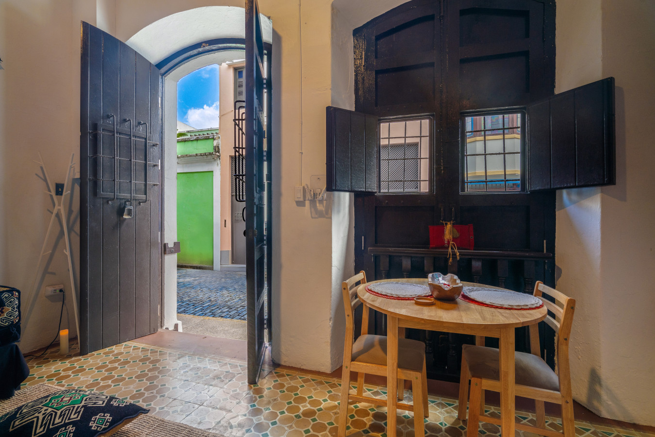 Dining table for two by the open front doors — Morocco Loft Sanjuanero | Viejo San Juan, Old San Juan