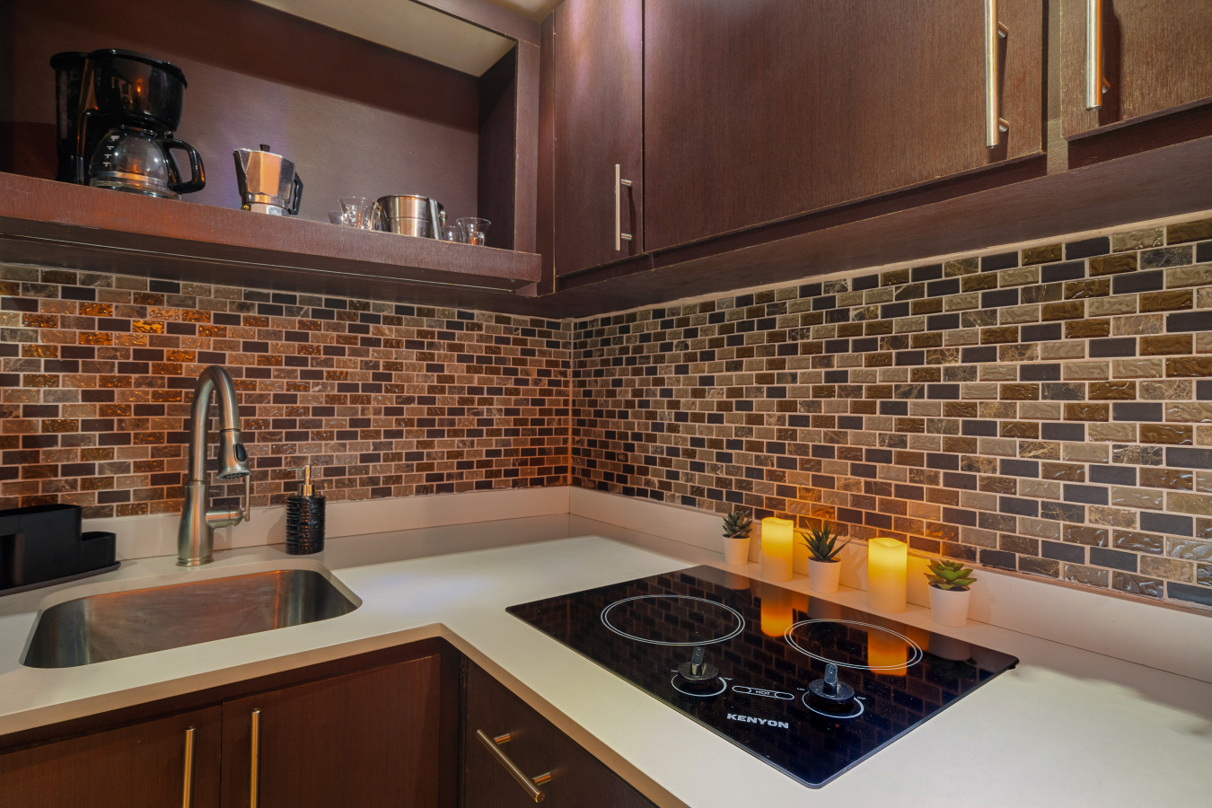 Kitchen with a two-burner cooktop and a sink — Morocco Loft Sanjuanero | Viejo San Juan, Old San Juan
