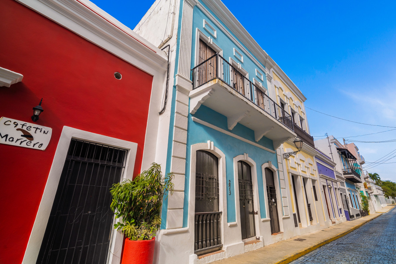 Blue and white building with a balcony on the second floor — Morocco Loft Sanjuanero | Viejo San Juan, Old San Juan