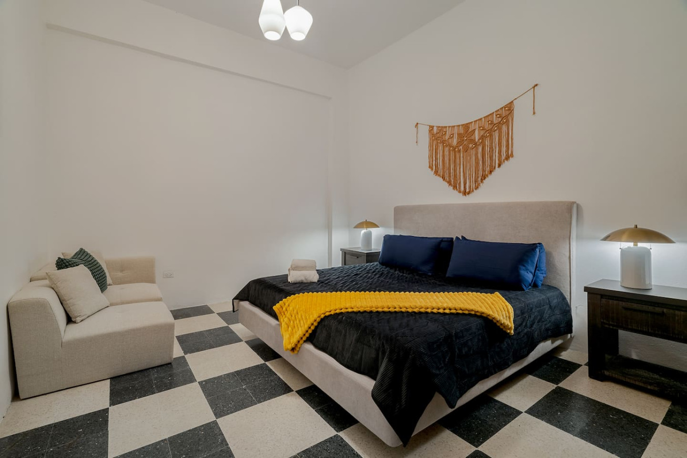 Bedroom with a bed, a chair, and a checkered floor — Royal Palm Old San Juan, Old San Juan