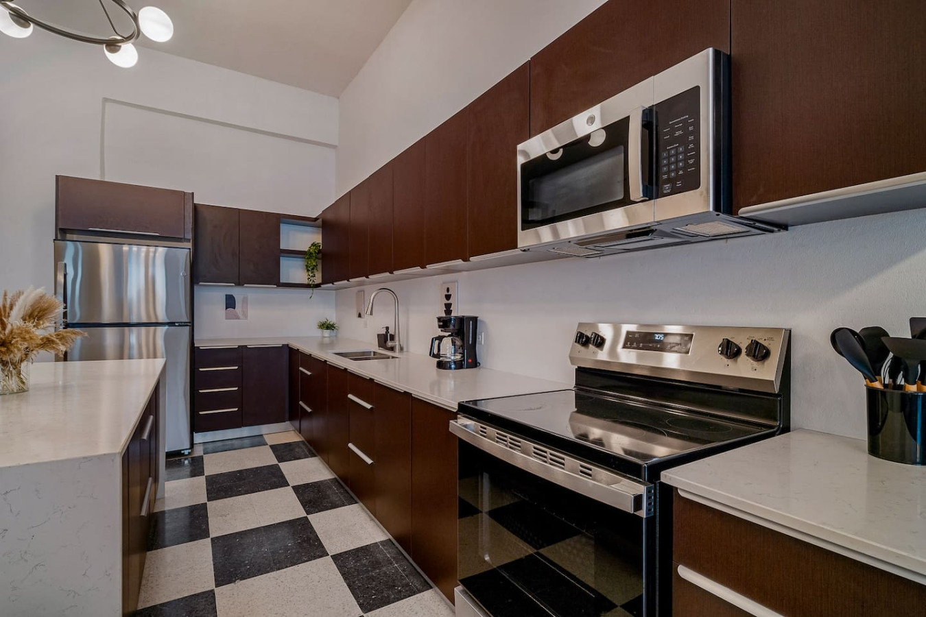 Kitchen with a black and silver oven and a silver microwave — Royal Palm Old San Juan, Old San Juan