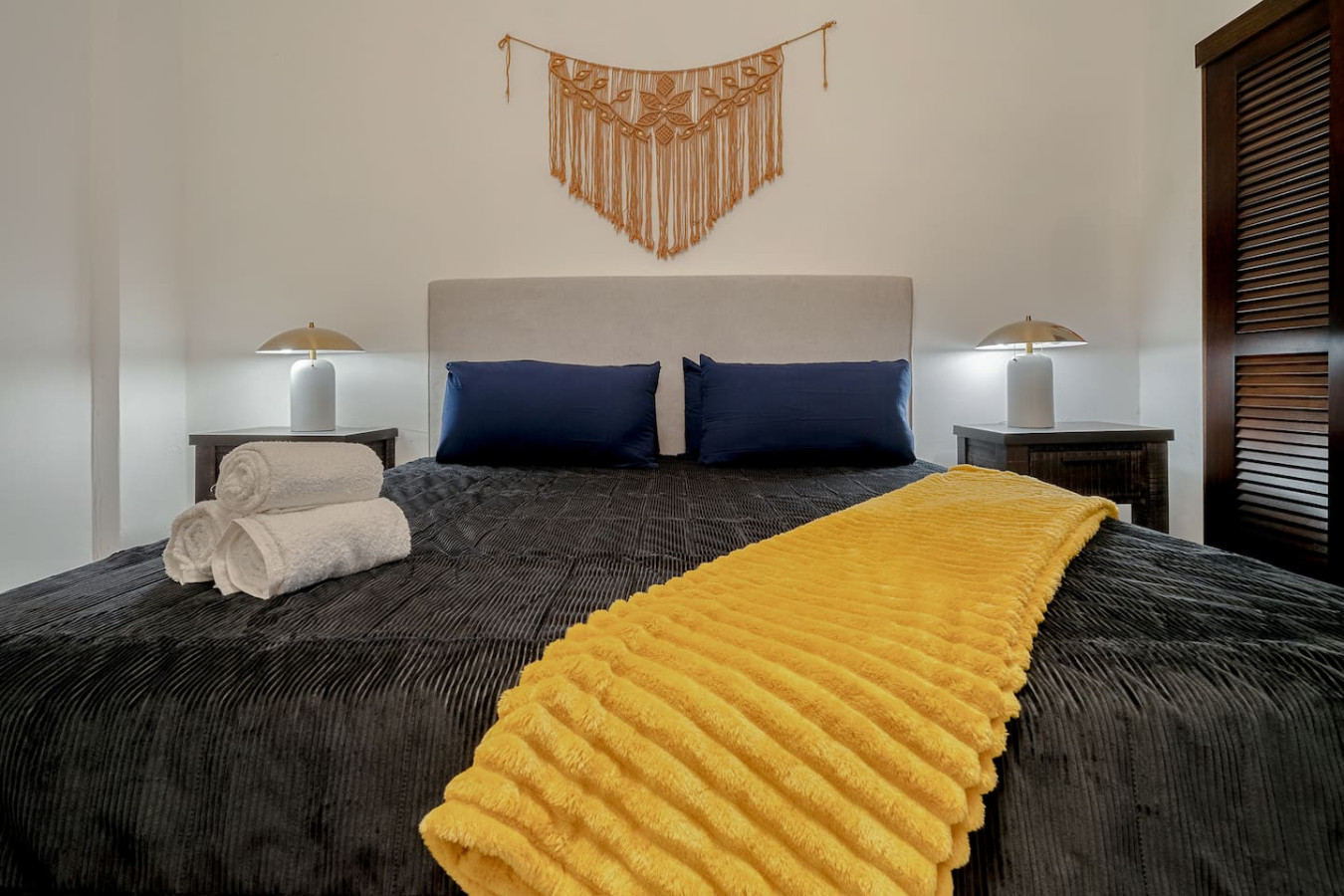 Bedroom with a yellow blanket on the bed — Royal Palm Old San Juan, Old San Juan