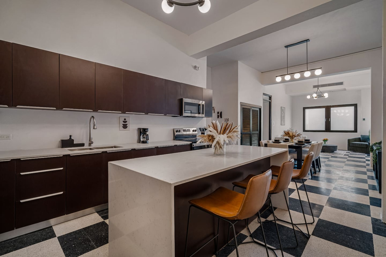 Kitchen with a white counter and a microwave on top — Royal Palm Old San Juan, Old San Juan