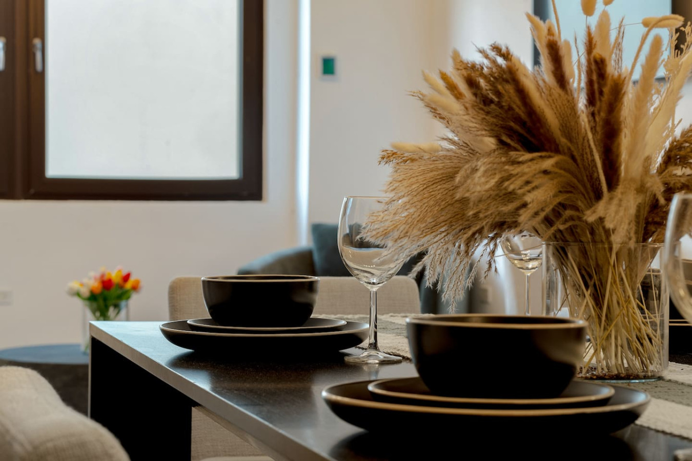 Table with black plates and wine glasses — Royal Palm Old San Juan, Old San Juan