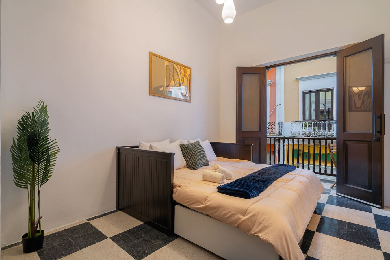 Bedroom with a bed, nightstand, and picture on the wall — Soho House  The Grand Patio, Old San Juan