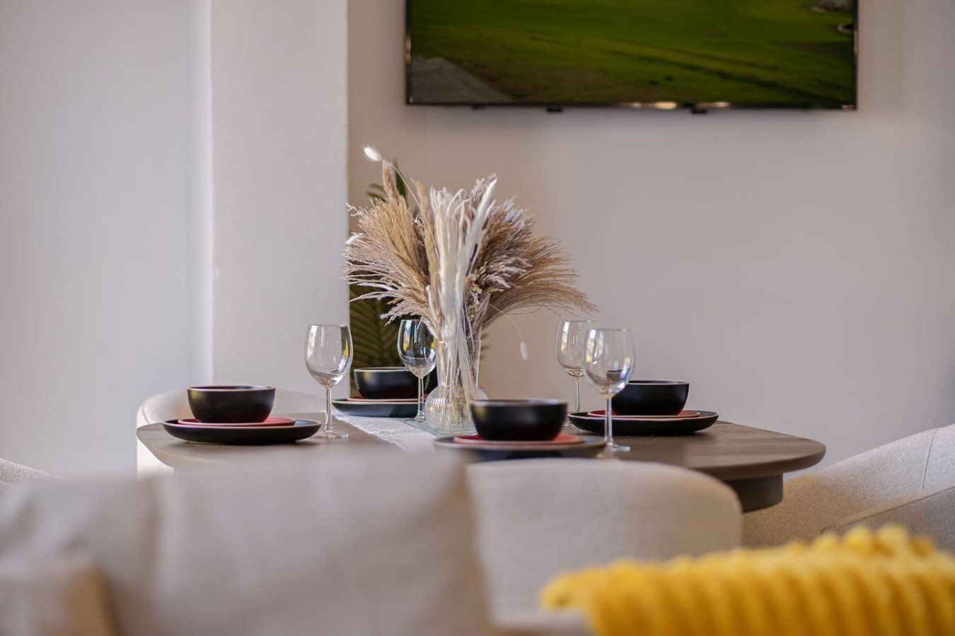 Table with wine glasses and bowls on it — Soho Garden Grand patio, Old San Juan