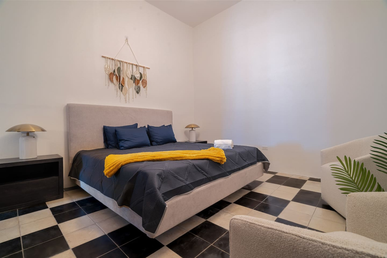 Bedroom with a bed and a yellow blanket on it — Soho House – Inspired by RH, Old San Juan