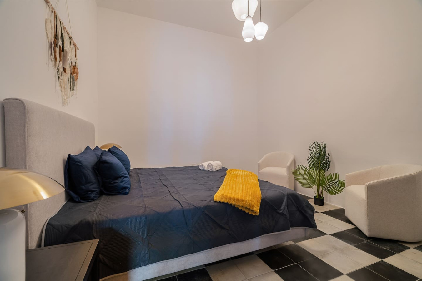 Bedroom with a blue bedspread and two pillows — Soho House – Inspired by RH, Old San Juan