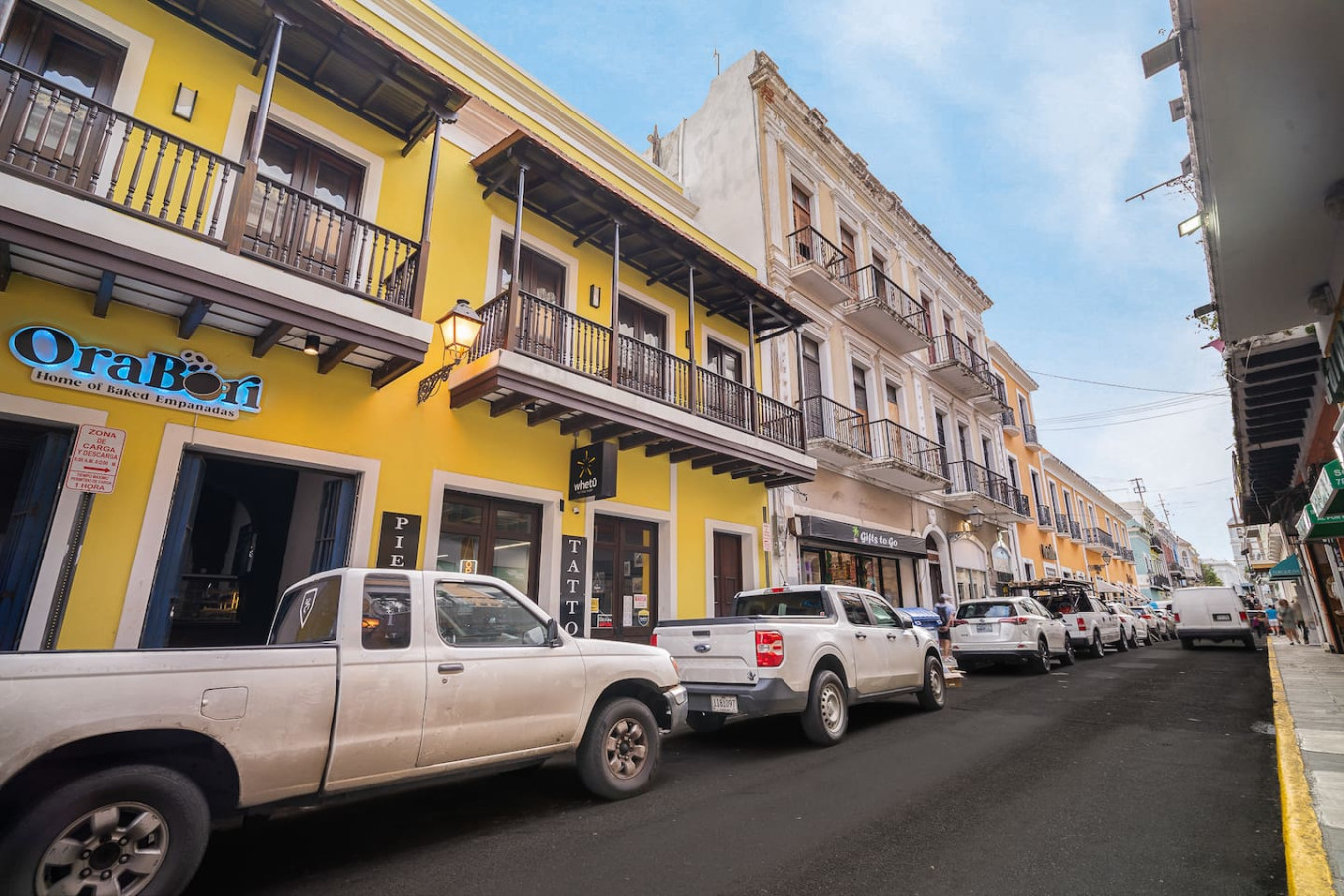 White truck parked in front of a yellow building — Soho House – Inspired by RH, Old San Juan