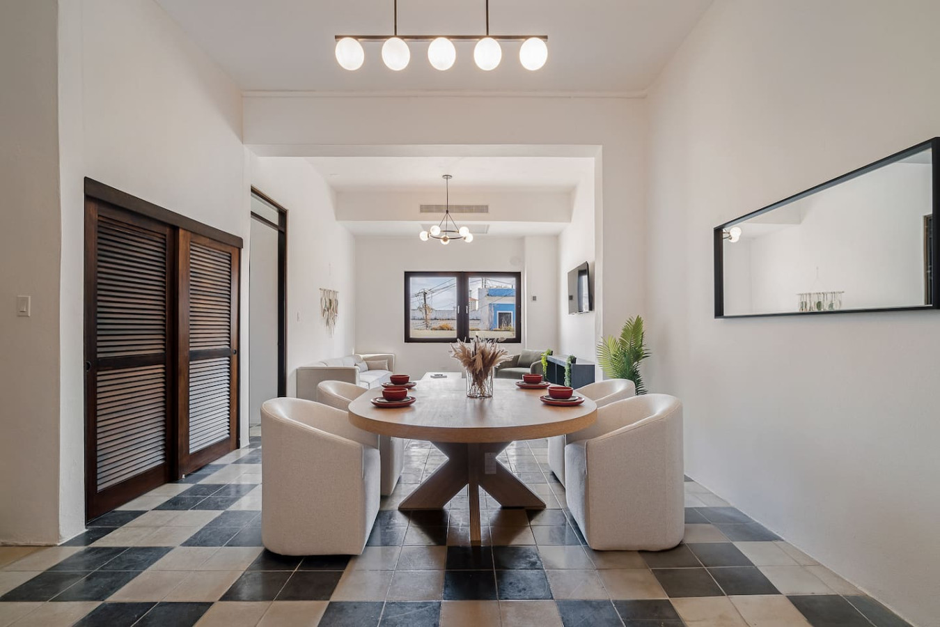 Dining room with a table and chairs — Soho House – Inspired by RH, Old San Juan