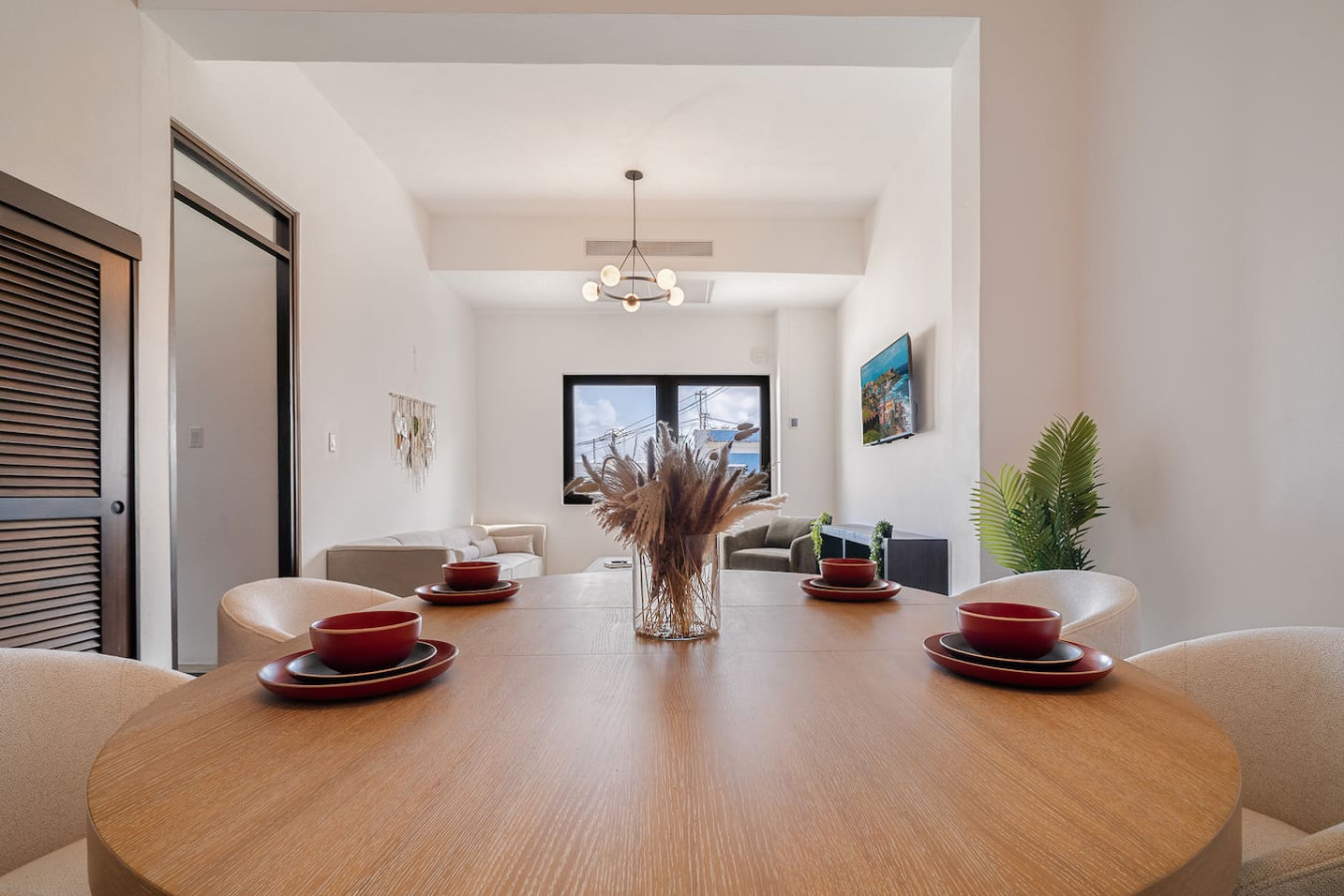 Dining room table with a vase of wheat on it — Soho House – Inspired by RH, Old San Juan