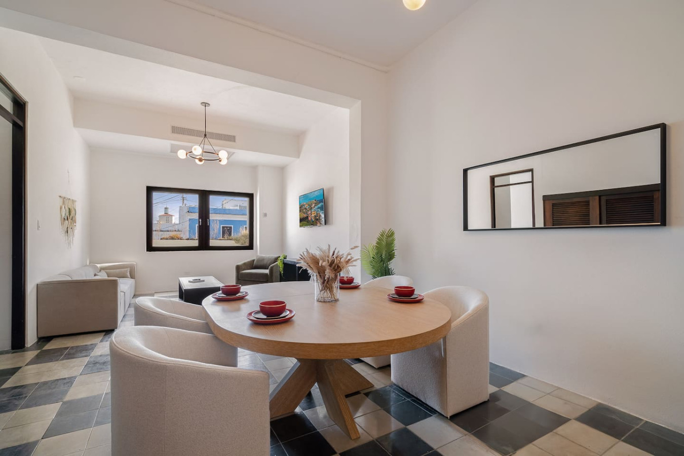 Dining room table with chairs and a view of the ocean — Soho House – Inspired by RH, Old San Juan