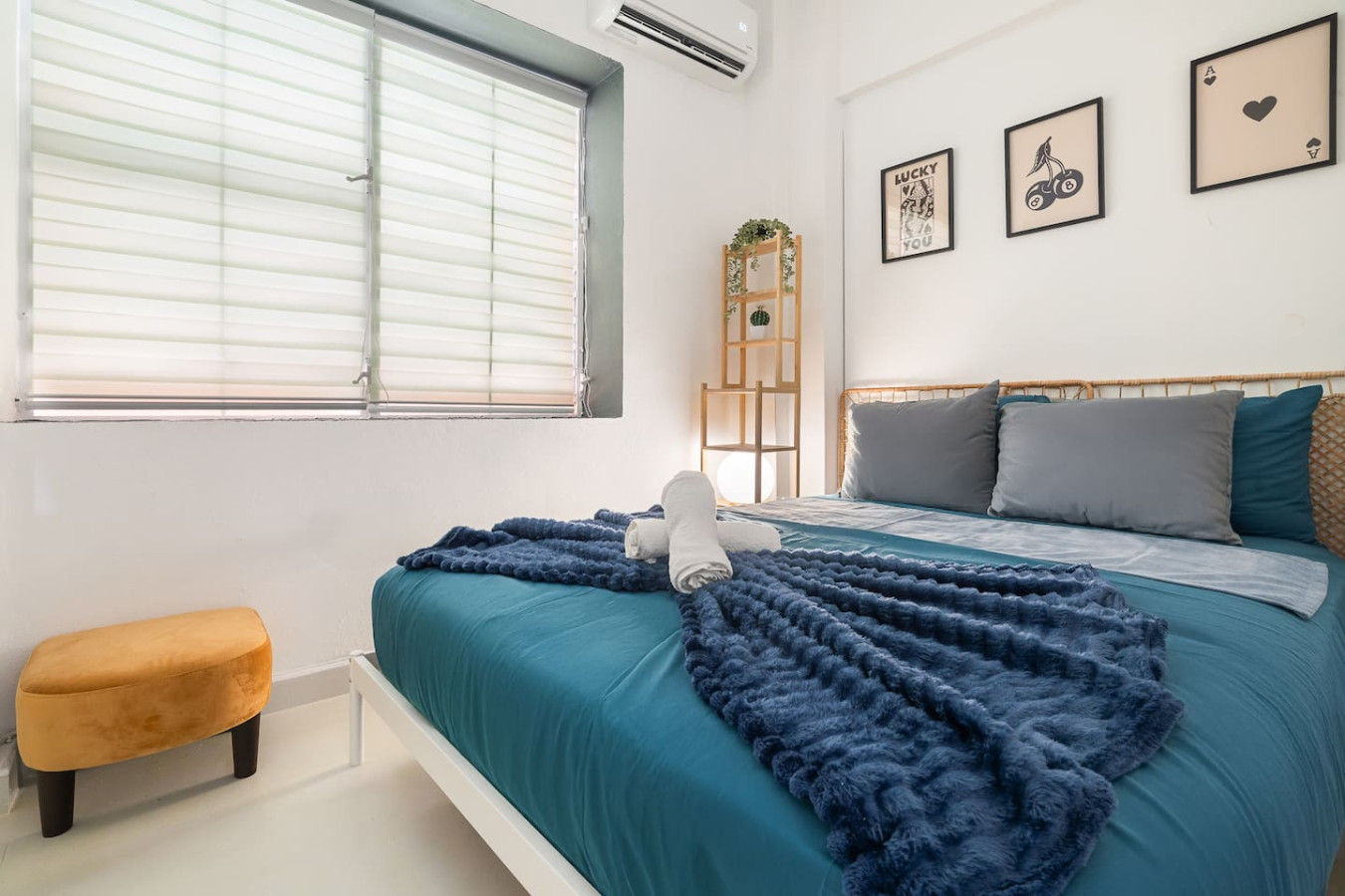 Bedroom with a blue bedspread and a white dresser — Puerto House - Private Patio, Santurce