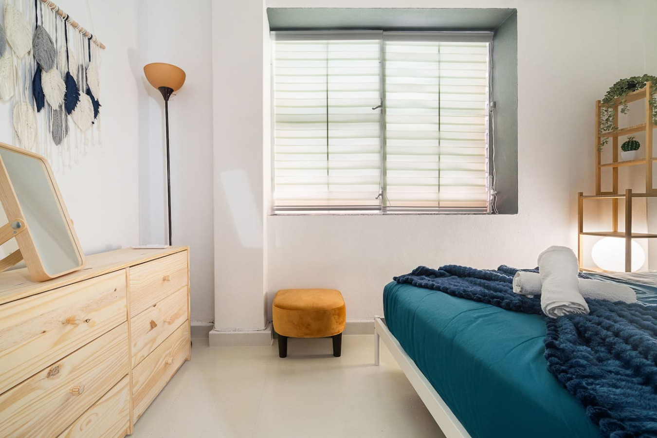Bedroom with a pine dresser, a floor lamp and a window — Puerto House - Private Patio, Santurce